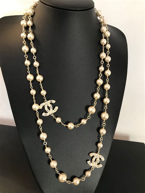 chanel logo neckalce|Chanel long pearl logo necklace.